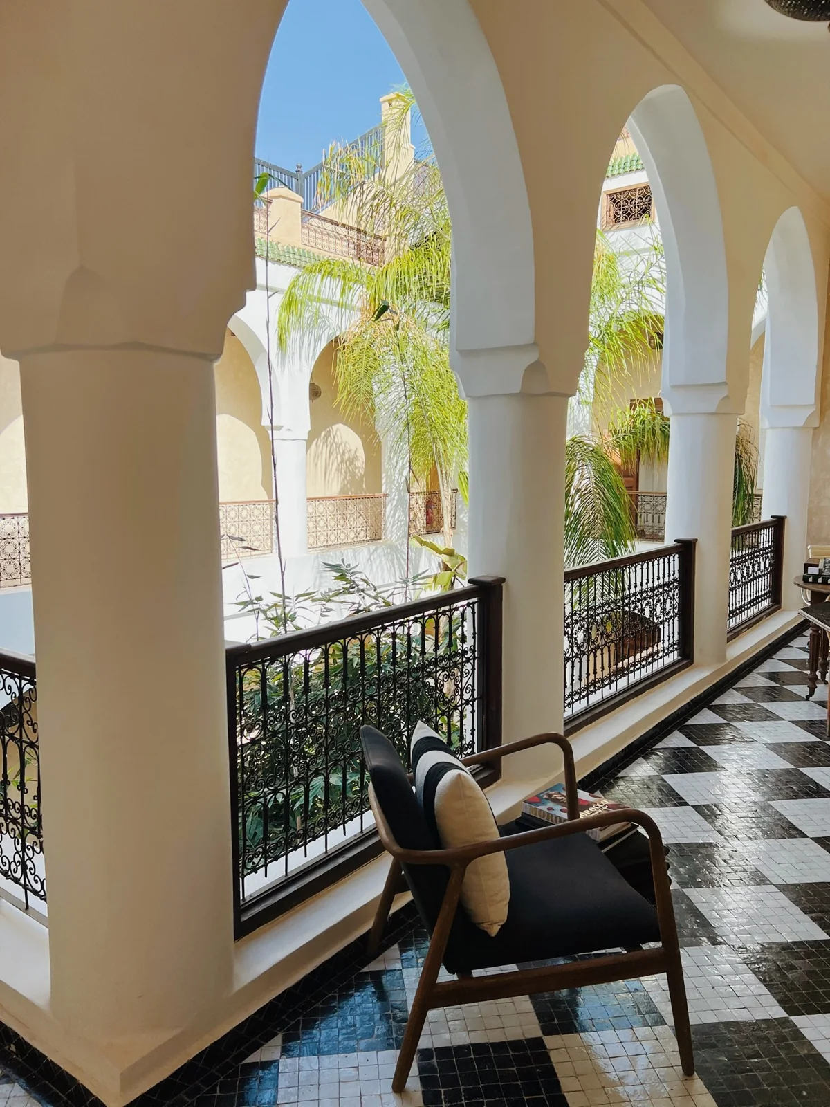 Sunlit arches overlooking a planted courtyard